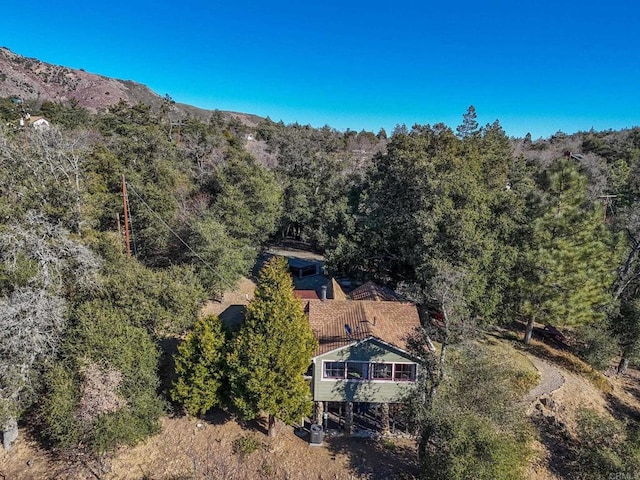 bird's eye view with a mountain view and a view of trees