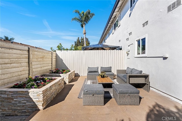 view of patio / terrace featuring outdoor lounge area and a fenced backyard