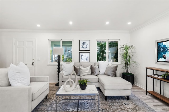 living room with recessed lighting, ornamental molding, baseboards, and wood finished floors