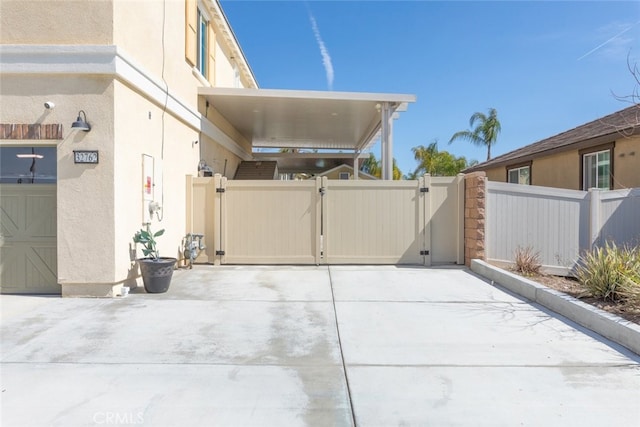 view of patio / terrace featuring a gate and fence