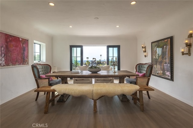 dining space featuring recessed lighting, baseboards, and wood finished floors