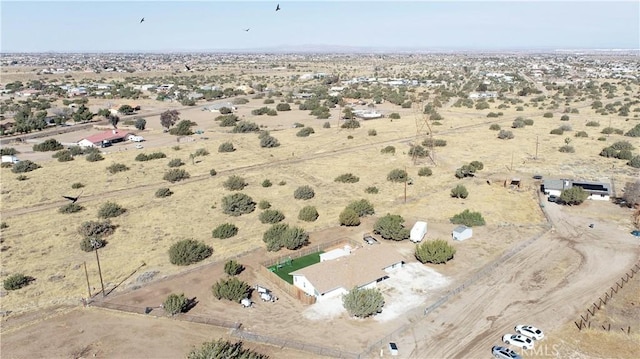 bird's eye view with view of desert and a rural view