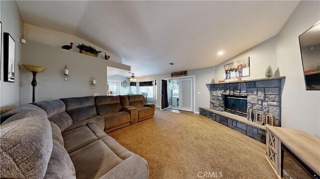 carpeted living area featuring vaulted ceiling, a fireplace, and visible vents