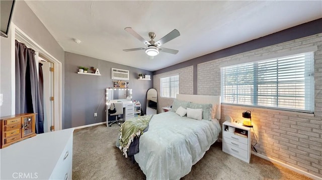 bedroom with carpet flooring, brick wall, and a wall mounted air conditioner