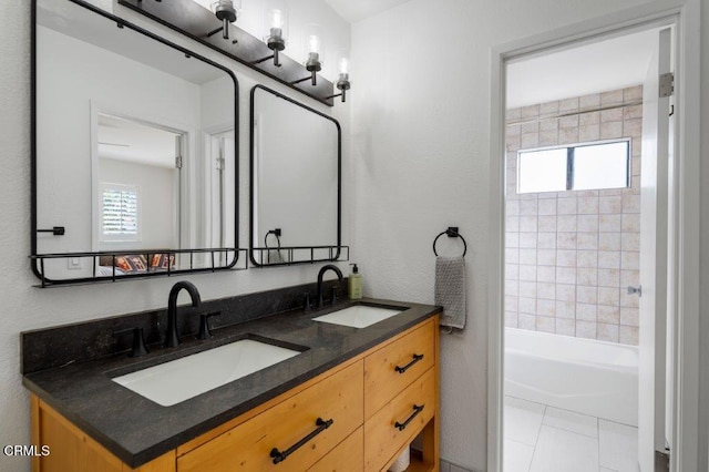 full bath with a sink, bathing tub / shower combination, double vanity, and tile patterned flooring