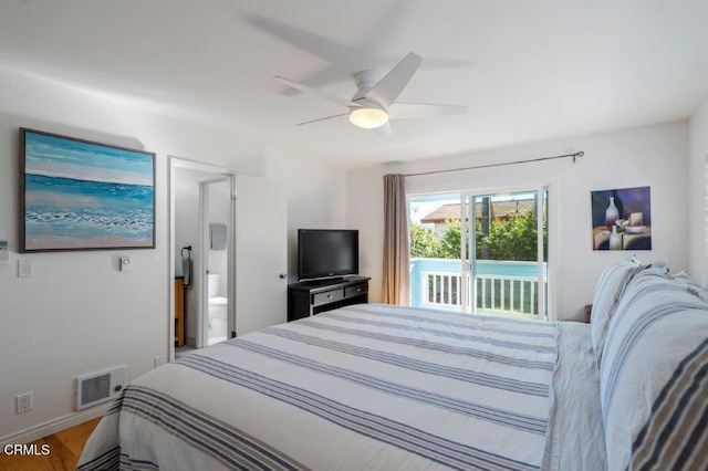 bedroom featuring visible vents, wood finished floors, ensuite bath, a ceiling fan, and access to outside