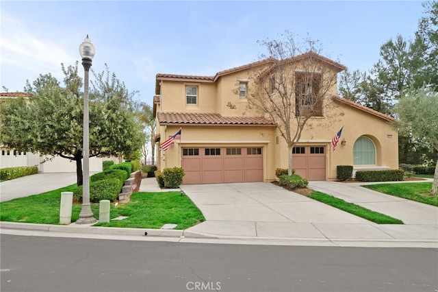 mediterranean / spanish-style home featuring a tiled roof, stucco siding, driveway, and a garage