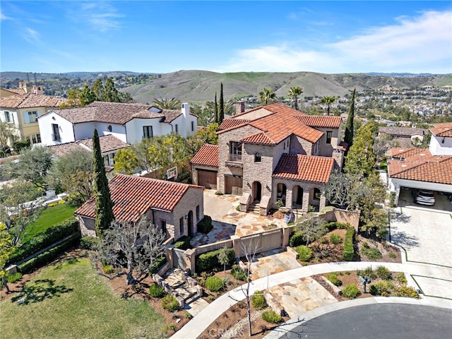 drone / aerial view with a residential view and a mountain view