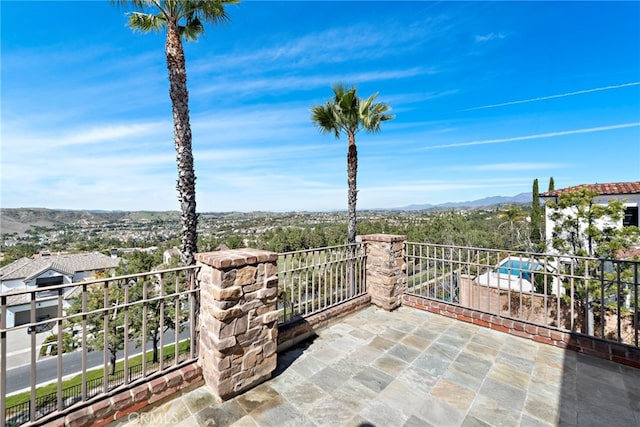 view of patio / terrace featuring a balcony and a mountain view