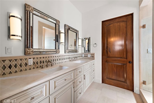 full bath with double vanity, decorative backsplash, and a sink