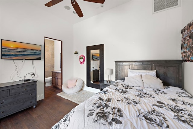 bedroom featuring visible vents, ensuite bathroom, dark wood-style floors, high vaulted ceiling, and a ceiling fan