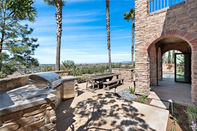 view of patio featuring outdoor dining space and area for grilling