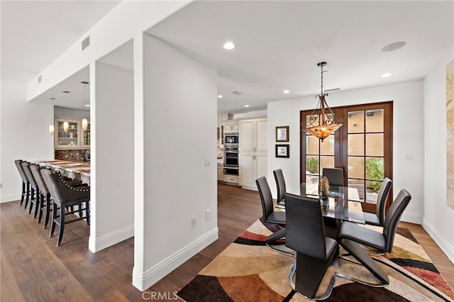 dining room featuring recessed lighting, visible vents, and dark wood-style flooring