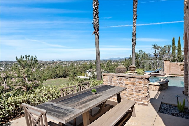 view of patio / terrace featuring outdoor dining space and fence