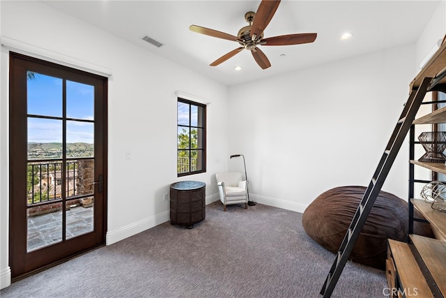 interior space featuring access to exterior, recessed lighting, baseboards, and visible vents