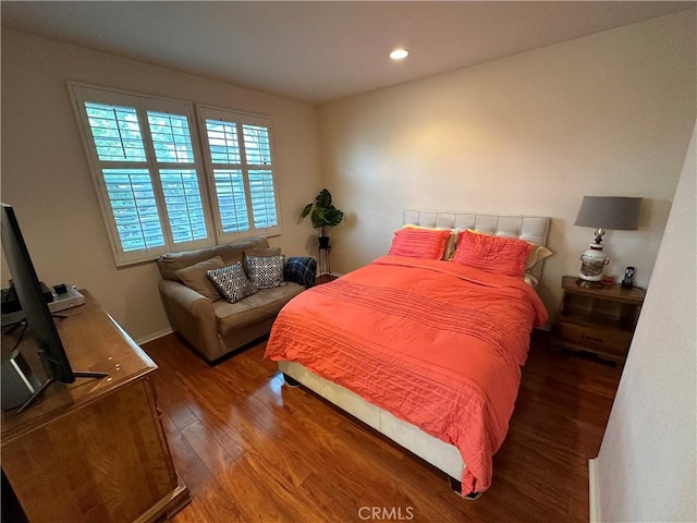 bedroom featuring recessed lighting, wood finished floors, and baseboards