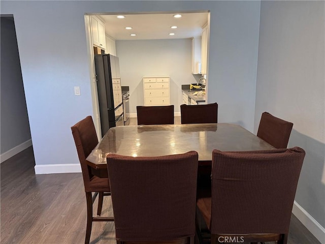 dining room featuring recessed lighting, baseboards, and dark wood-style floors