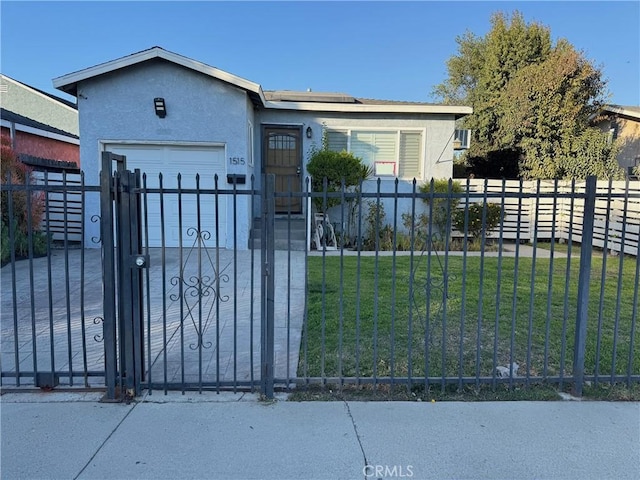 view of front of property with a front yard, a garage, a fenced front yard, and stucco siding