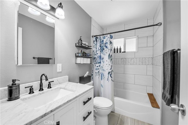 bathroom featuring vanity, shower / tub combo, and toilet