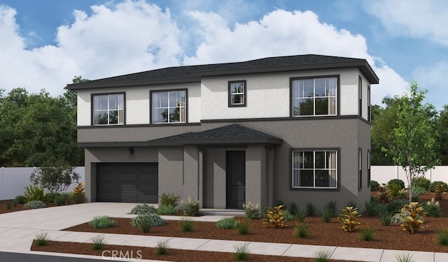 view of front of house with stucco siding, driveway, a garage, and fence