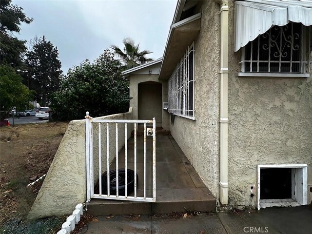 view of side of property featuring stucco siding