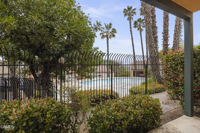 community pool featuring fence