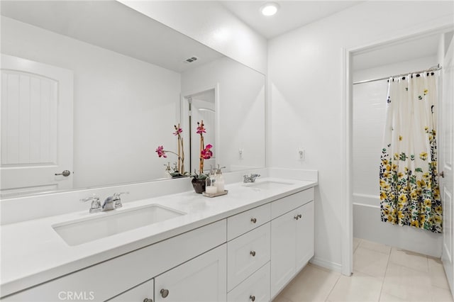 bathroom featuring a sink, shower / tub combo, double vanity, and tile patterned floors