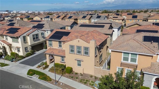 birds eye view of property with a residential view