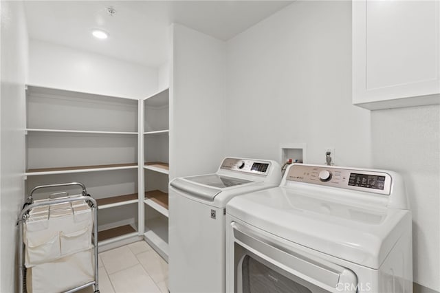 laundry area featuring light tile patterned flooring, laundry area, and separate washer and dryer