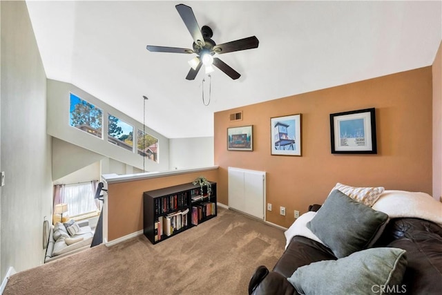 carpeted living area featuring visible vents, ceiling fan, lofted ceiling, and baseboards