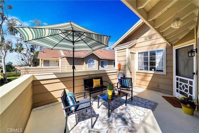 view of patio / terrace featuring a balcony