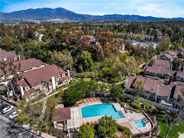 drone / aerial view featuring a residential view and a mountain view