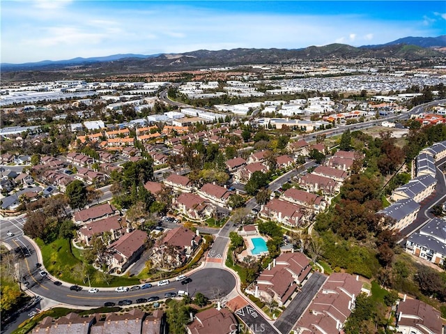 drone / aerial view featuring a residential view and a mountain view