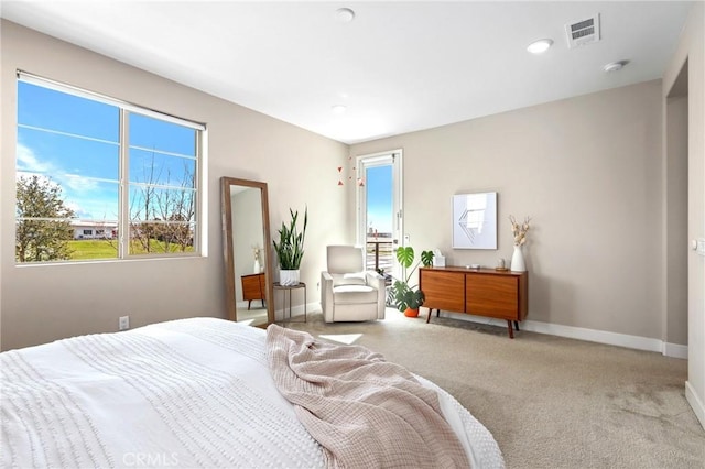 bedroom featuring visible vents, baseboards, and carpet flooring