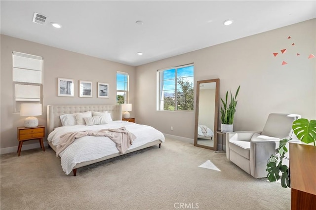 bedroom with recessed lighting, visible vents, baseboards, and light colored carpet