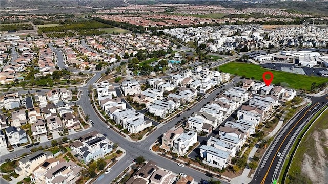 birds eye view of property with a residential view