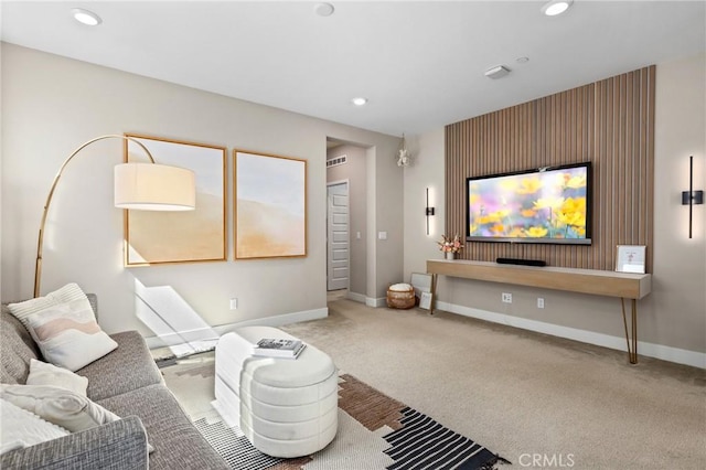 carpeted living room featuring recessed lighting and baseboards