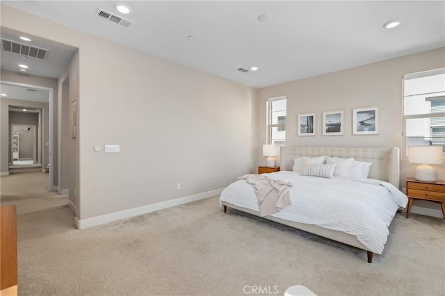 bedroom featuring recessed lighting, visible vents, light carpet, and baseboards