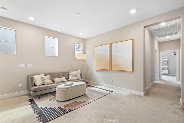 living room featuring recessed lighting, visible vents, light carpet, and baseboards