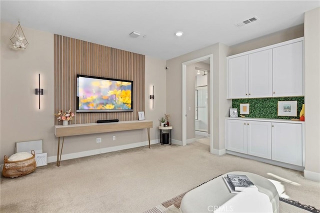 cinema featuring recessed lighting, light colored carpet, visible vents, and baseboards