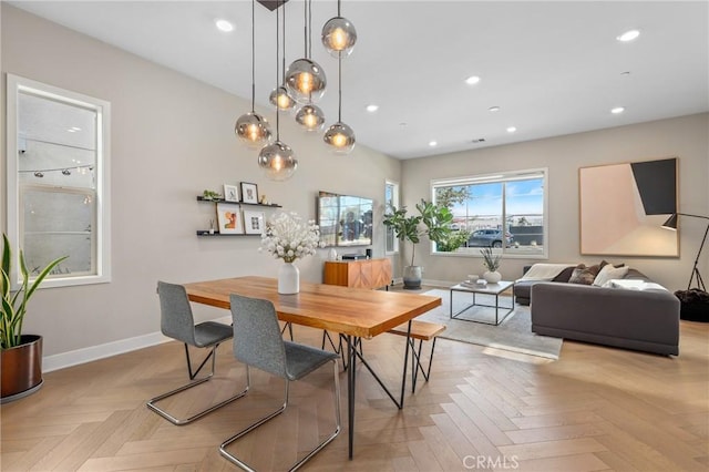 dining room featuring recessed lighting and baseboards