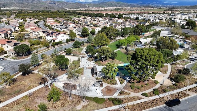 birds eye view of property with a mountain view and a residential view