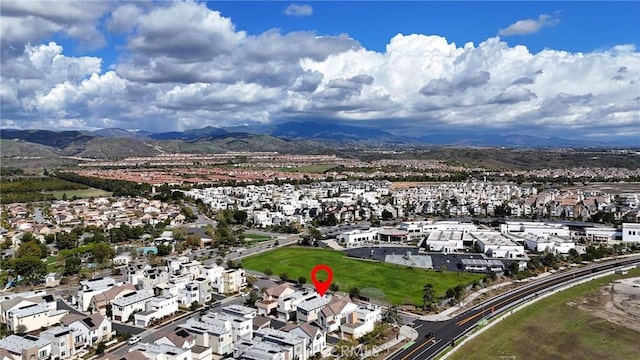 birds eye view of property featuring a mountain view and a residential view