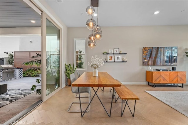 dining area with recessed lighting and baseboards