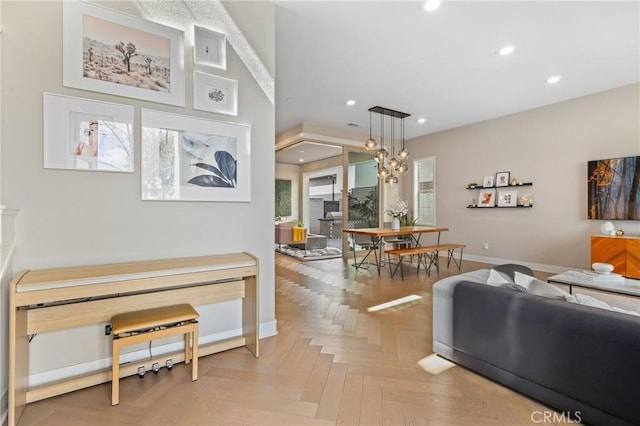 living area featuring recessed lighting, baseboards, and a wealth of natural light