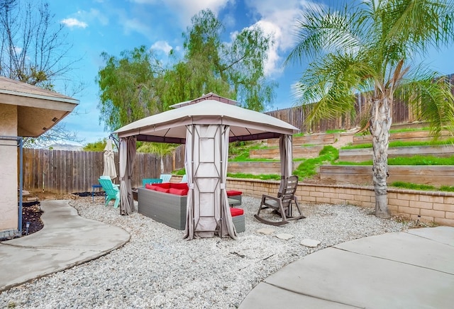 view of patio with a gazebo and a fenced backyard