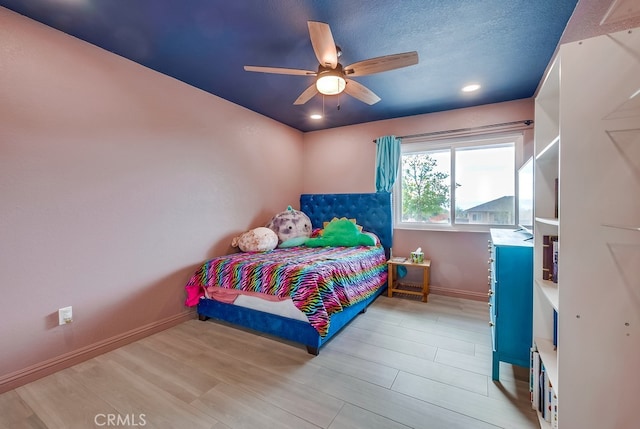 bedroom with ceiling fan, baseboards, recessed lighting, wood finished floors, and a textured ceiling