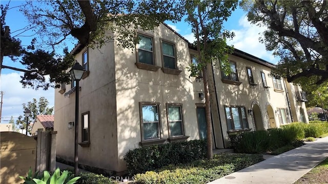 view of side of home featuring stucco siding