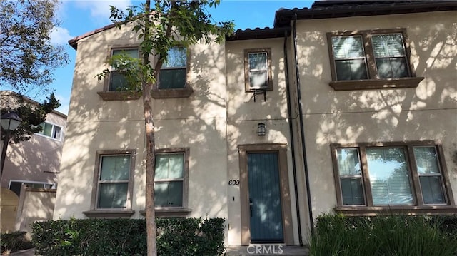 view of front of house featuring stucco siding