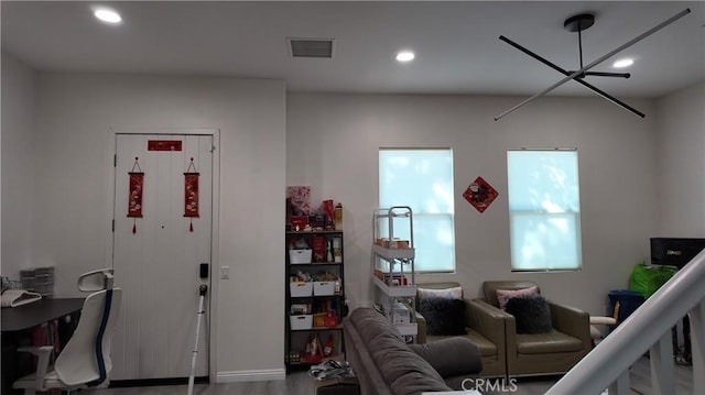 living area with recessed lighting and visible vents